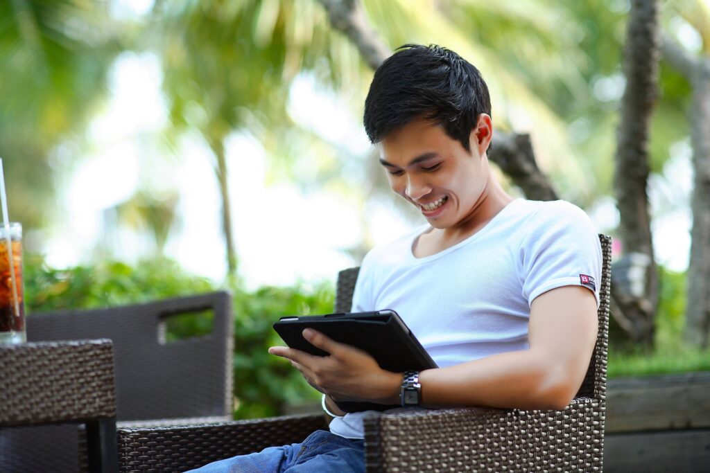 Guy looking at his tablet