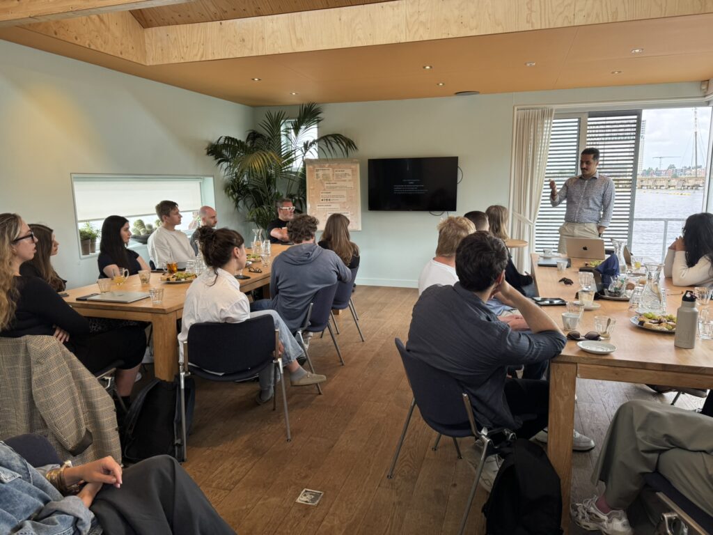 Photo of someone giving a workshop on a cool location.